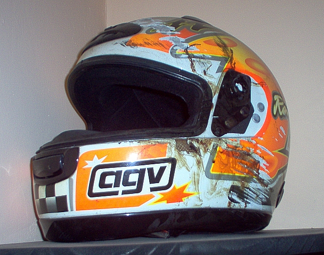 Smashed and bloody motorcycle helmet