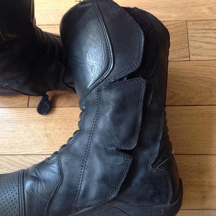 The boot is now closed with the flap secured by the velcro covering the zip