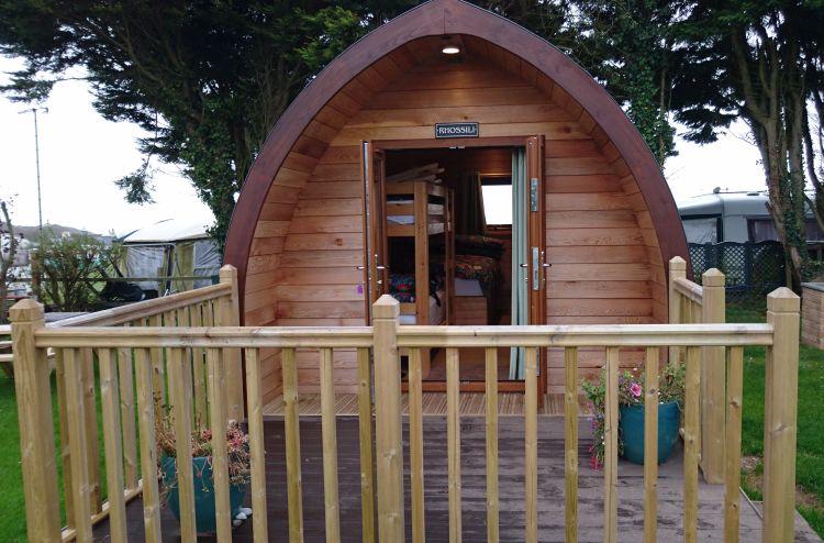A camping pod, a fair sized wooden shelter complete with beds, heater and other such comforts