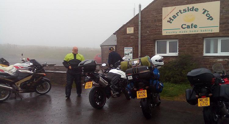 Motorcycles outside the Hartside Top cafe, shrouded in mist and rain