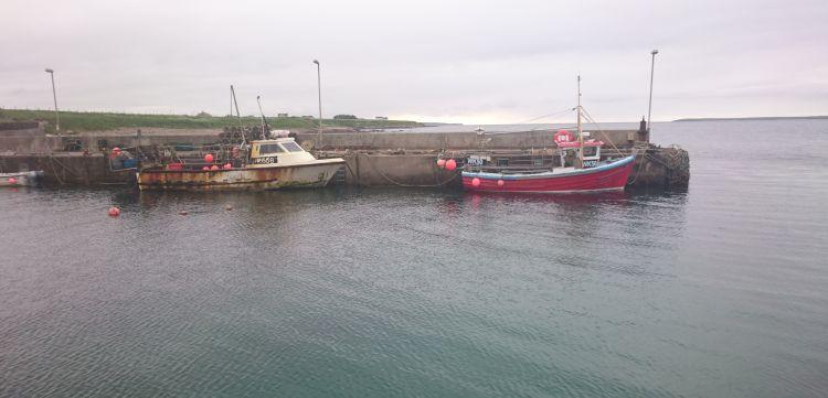 2 old small fishing boat at the harbour in John O'Groats