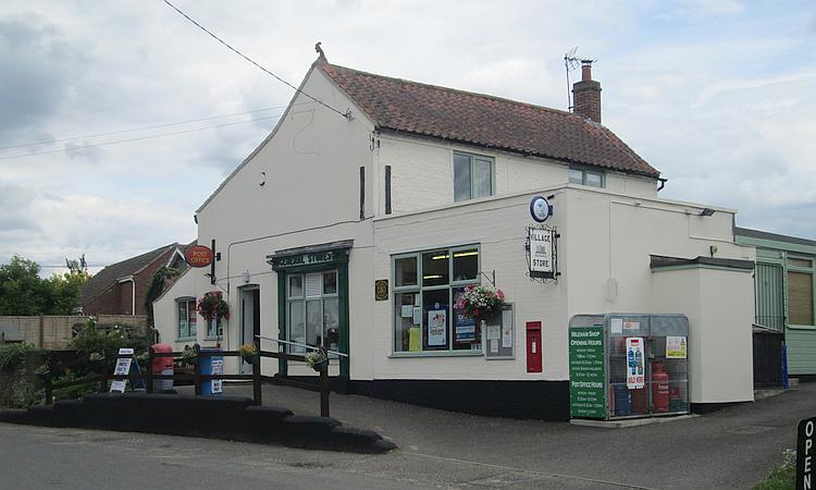 The shop in Mileham, a white building in a rural village in Norfolk