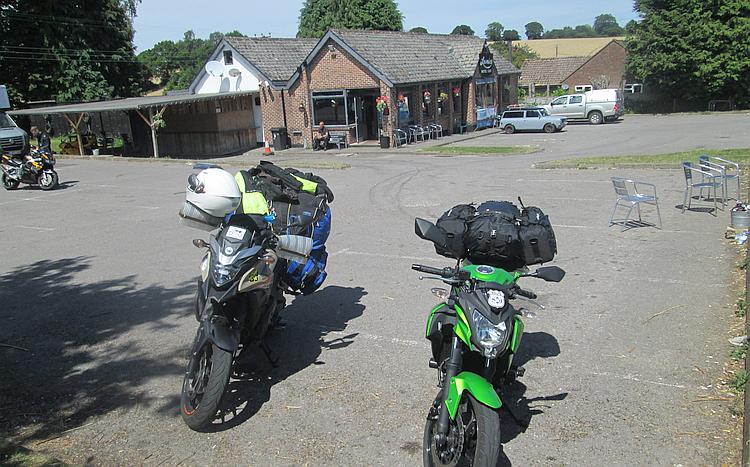 Ren and Sharon's motorcycles outside Loomies biker cafe in glorious hot sunshine