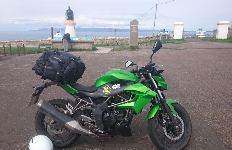 Sharon's famous Kawasaki Z250SL with luggage at Dunnet Head Lighthouse
