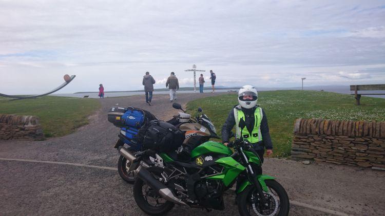 Sharon stands by her Z250SL at the John O'Groats signpost