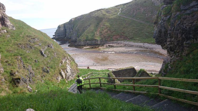 The steep steps cut into the side of the cove leading to Smoo Cave