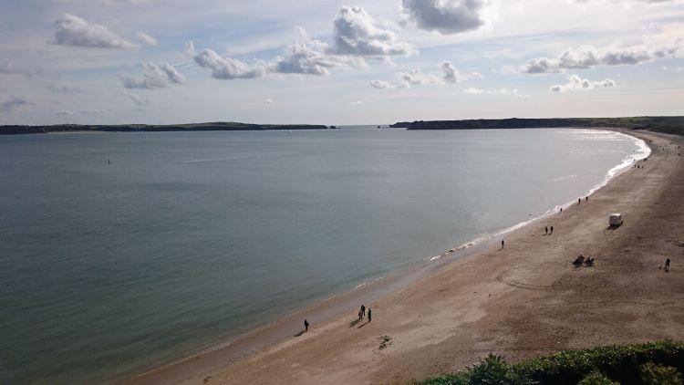 The broad and long beach at Tenby seen from the cliffs above