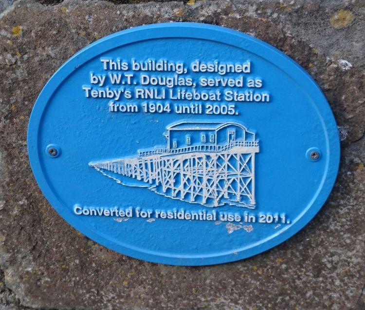 A blue commemorative place recording the creator of the lifeboat station and it's change to a dwelling