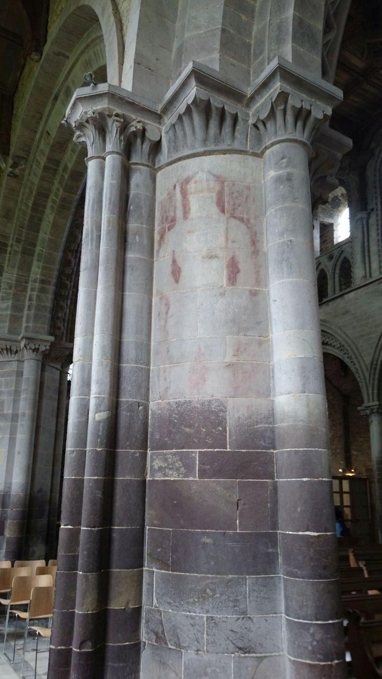The outline of a knight is seen faintly on a massive column in the cathedral