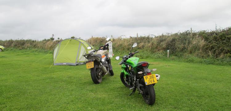 The motorcycles next to the tent, they're staying put today