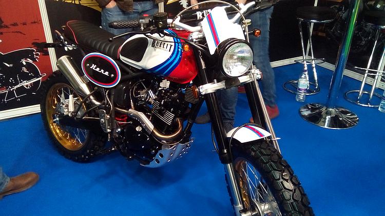 A Bullit Scrambler motorcycle. Retro styling but long travel suspension in a new bike