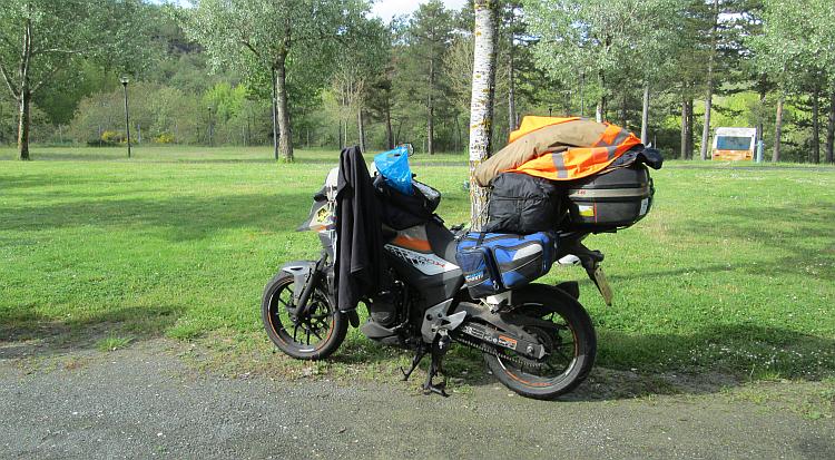 Ren's Honda CB500X full loaded with all the camping and travel gear at the campsite near Burgos