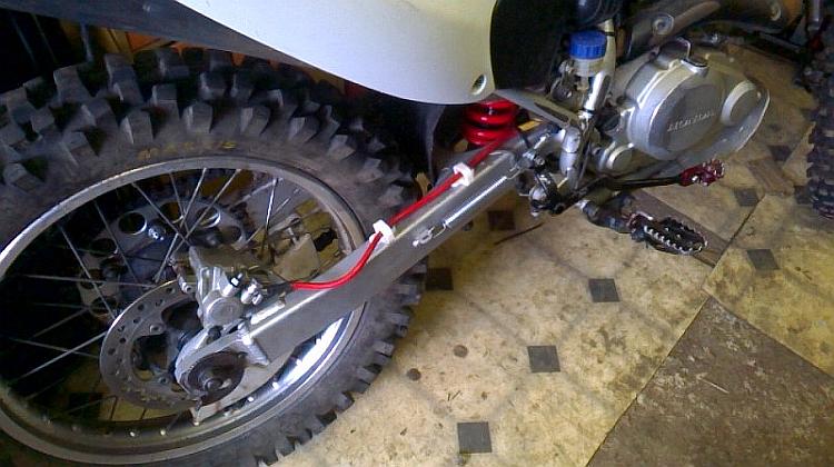 A CRF230 that had a drum brake now has a disc brake fitted to the rear wheel