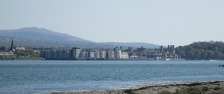 Across the Menai Strait we can see the town and castle of Caernarfon