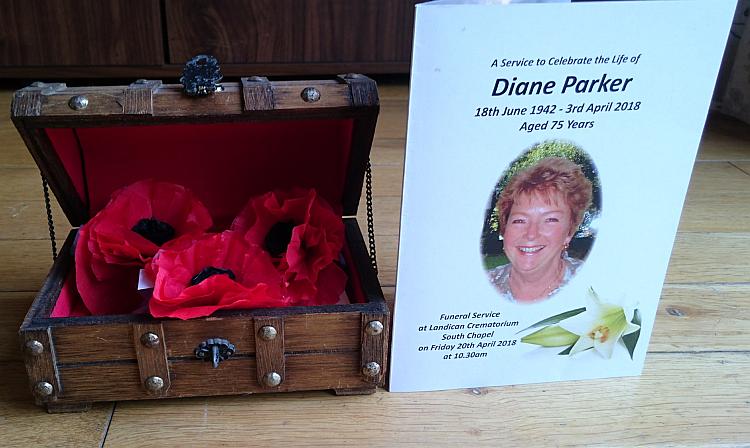 Paper poppies in a box and the service of remembrance card from Diane's funeral