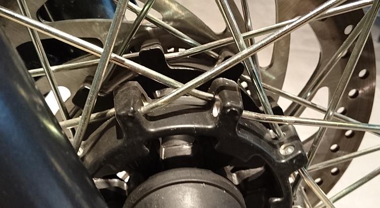 The thick spokes locate in a cleverly cast hub