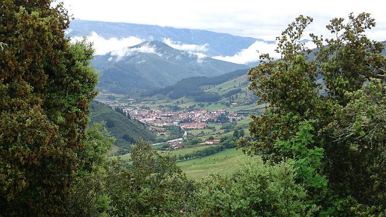 The town of Potes looks quite small in the foot of the valley between majestic verdant mountains
