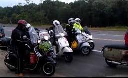 A motley collection of scooters on the road in Georgia