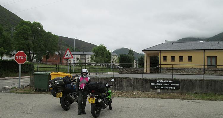 Sharon and the loaded bikes on a rather plain car park of a plain town heading north