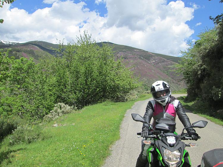Sharon on her bike with the stunning Sierra De La Demanda mountain range behind her