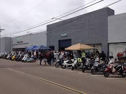 A small image of the scooters outside the Motorsport shop at the end of the ride