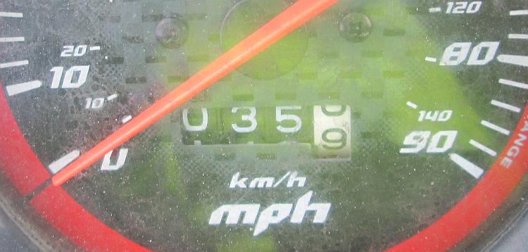 an old trip meter on a motorcycle