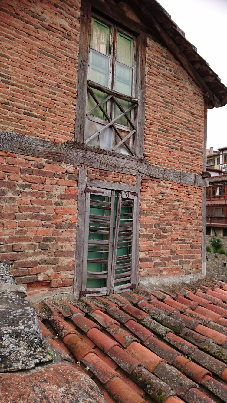 ancient thin bricks and terracotta clay roof tiles form the character of Potes