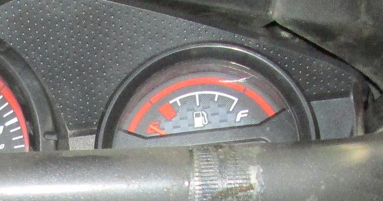 The fuel gauge on the CBF125 with the needle right at the bottom of the scale