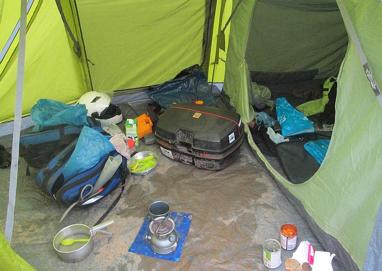 Ren's kit is spread around the tent with mud on the floor and other places
