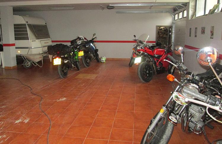 Inside the garage is smart and spacious with several other motorcycles inside