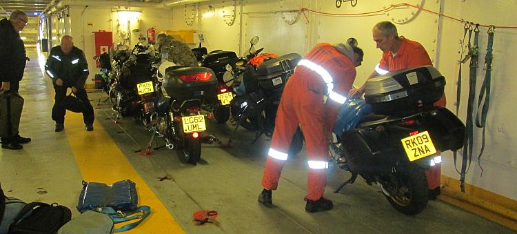 The motorcycles are squashed into a corner on the ferry