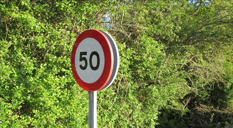 A standard 50 in a red circle as the speed limit sign in Spain