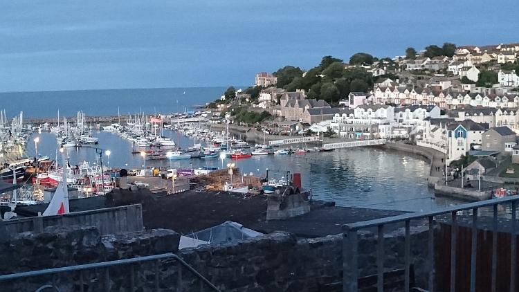 Looking down on Brixham Harbour we see boats, yachts, fishing boats and all manner of building