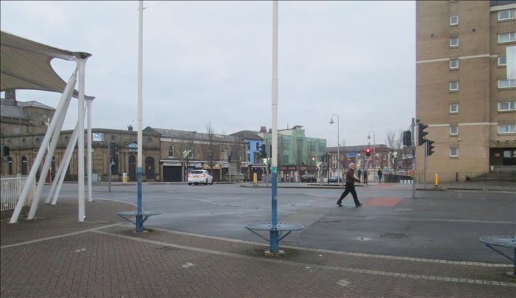 Southport is grey and devoid of life save for one person walking across the shot