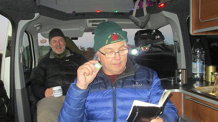 2 chaps are fooling around in the warmth of a small campervan