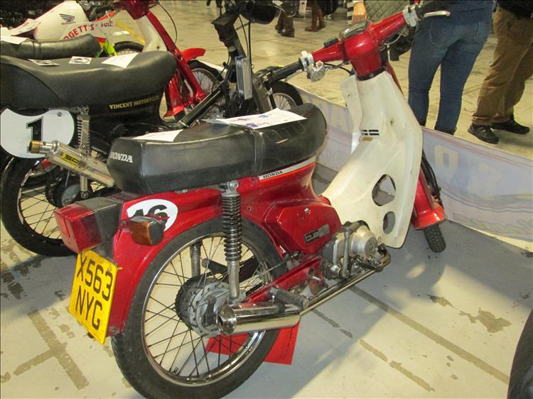 A Honda C90 at a motorcycle show in Manchester
