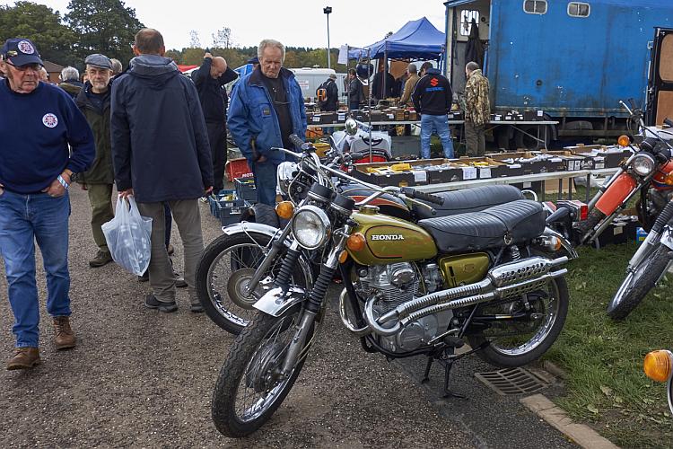 A Honda CB350 at the Classic Stafford show amidst lots of older men all milling around