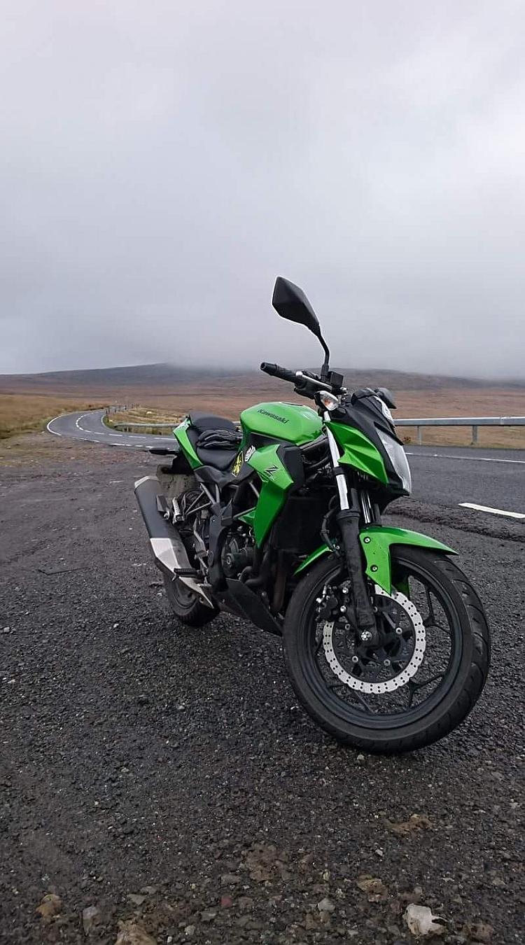 The Kawasaki Z250SL on top of a foggy misty hill in Wales. Moody and mysterious