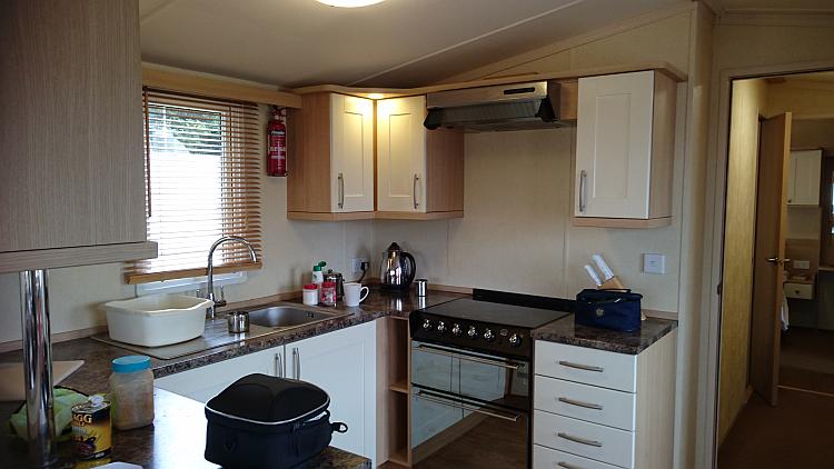 A clean and well provisioned kitchen within the static caravan that we are staying at