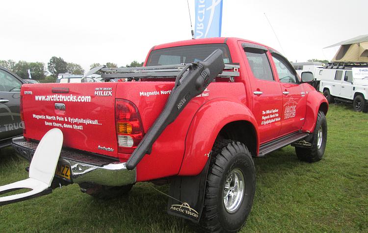 A brught red very large pickup truck used by Top Gear to drive to the North Pole