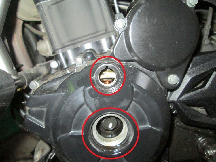 The left side of the motor with the access holes removed and circled in red
