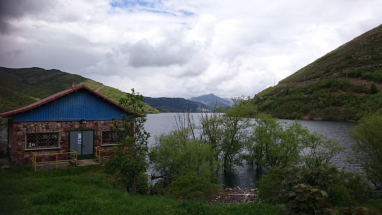 What appears to be a small lodge with the beautiful reservoir and hills behind