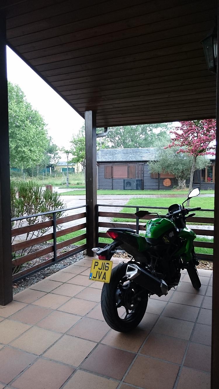 Sharon's 250 is dry under the veranda while the heavy rain soak outside