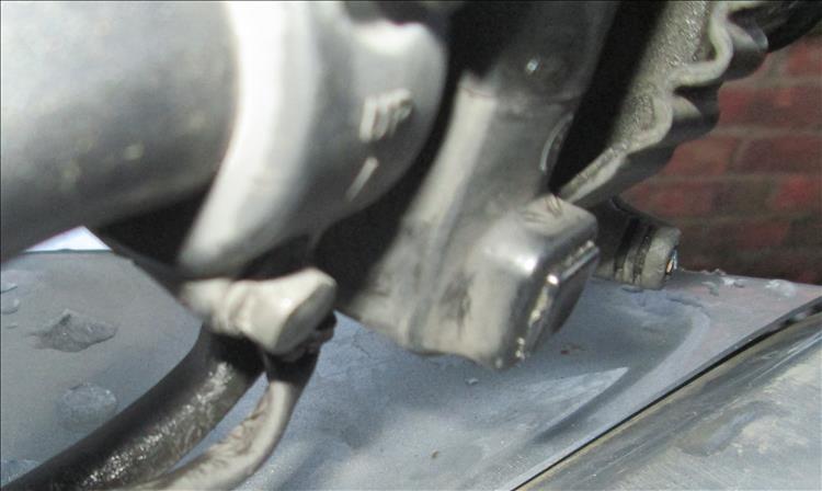 The starter button on the motorcycle is frozen into a pushed in position leaving the starter motor running