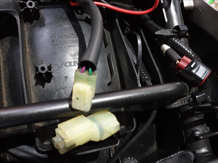The options plug under the seat of the Honda CB500X