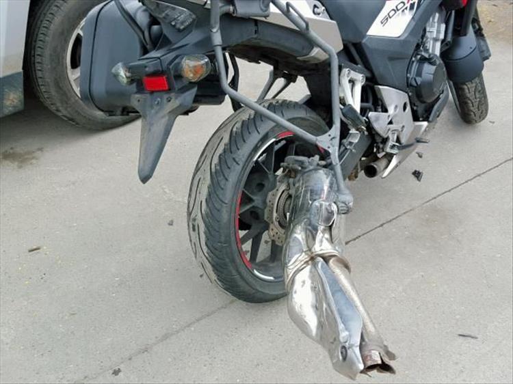 Pete's CB500X after the crash. Exhaust ripped off pannier missing