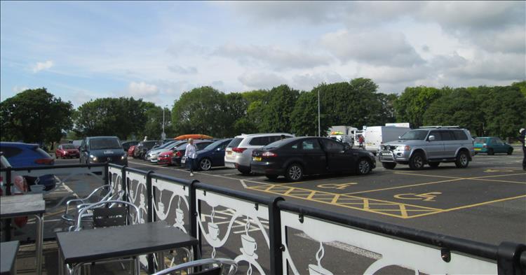 A car park and seating at the services on the M6
