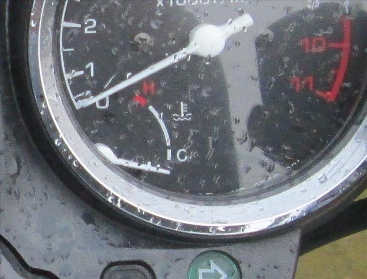 A fuel gauge on a motorcycle dashboard