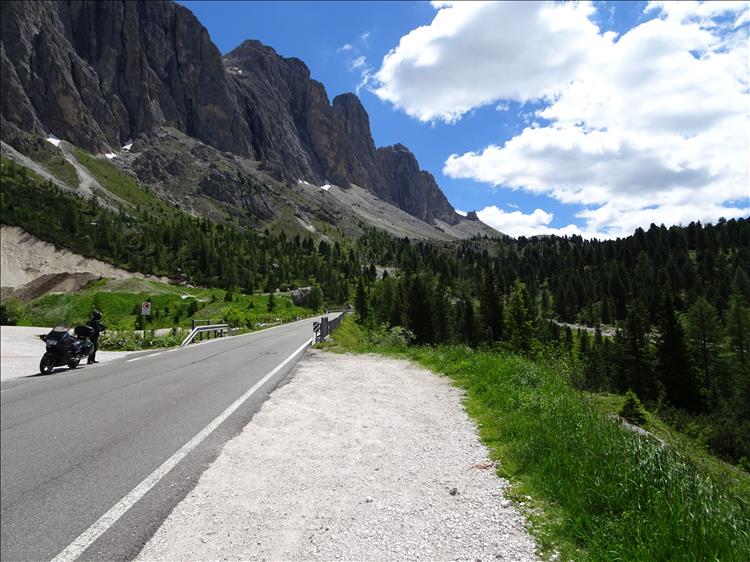 The Pan European Honda set against massive almost vertical rock faces in the Dolomite Mountains