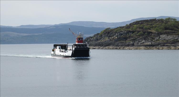 A small ferry on the incredibly calm waters of Loch Fyne